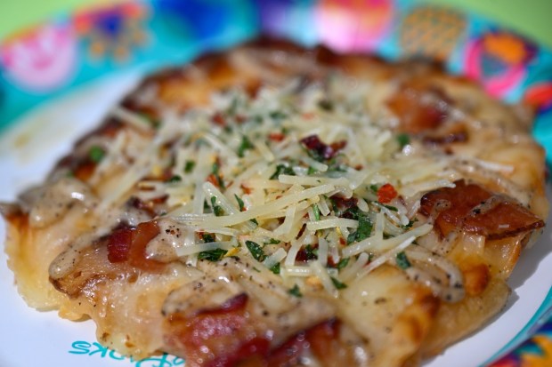 Carbonara Pizzetta; white sauce, Nueske's applewood smoked bacon and black pepper drizzle at the LA Style festival marketplace food booth during the California Food & Wine Festival inside California Adventure running March 6 through April 27, 2026. Photographed on Friday, March 6, 2026. (Photo by Jeff Gritchen, Orange County Register/SCNG)