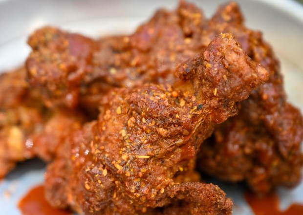 Tajín Habanero Seasoned Wings with Tajín chile-lime sauce at the Peppers Cali-Ente festival marketplace food booth during the California Food & Wine Festival inside California Adventure running March 6 through April 27, 2026. Photographed on Friday, March 6, 2026. (Photo by Jeff Gritchen, Orange County Register/SCNG)