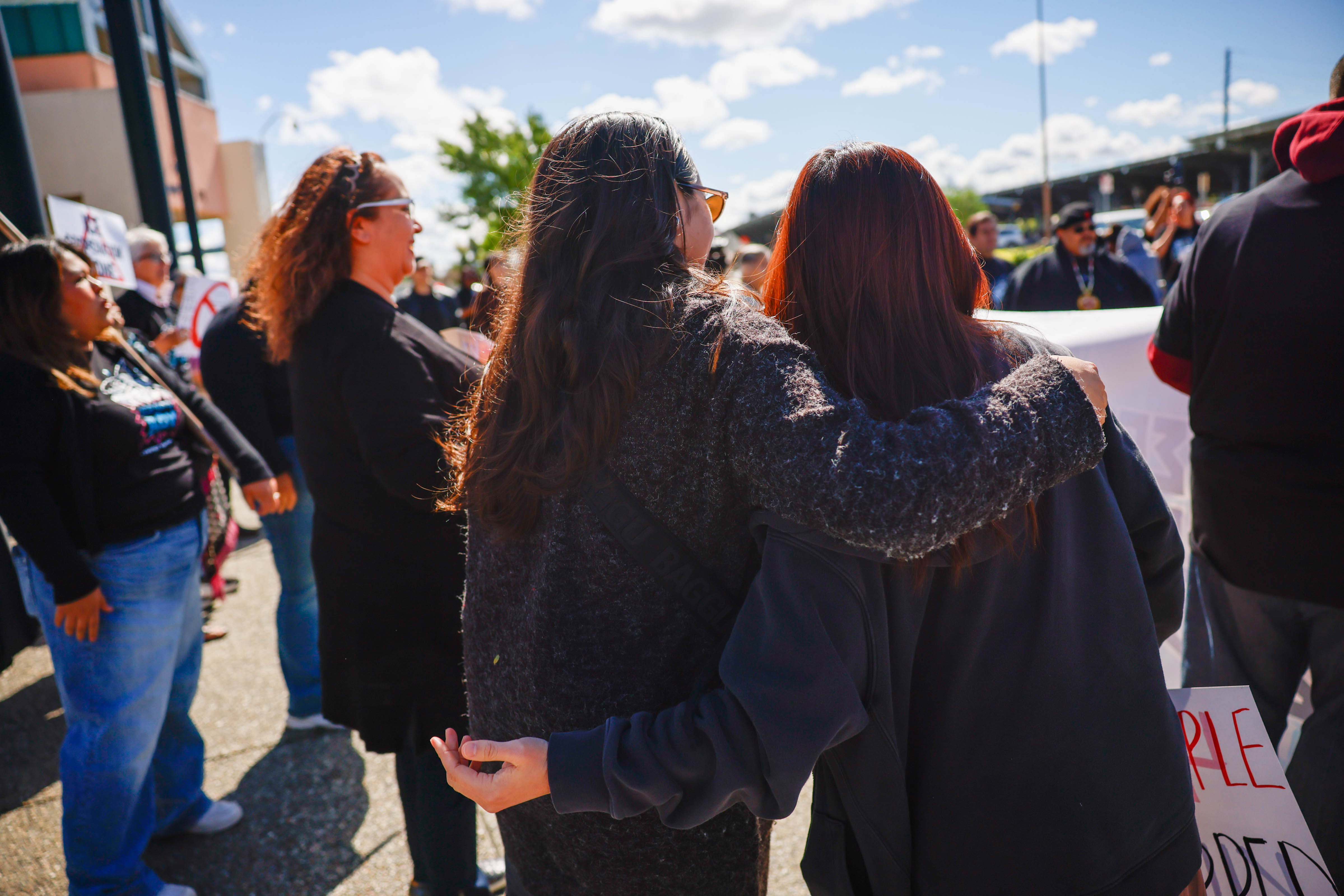 People embrace while protesting ICE at Elmwood Jail in Milpitas,...