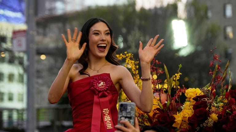 Olympic gold medalist and Grand Marhsal Eileen Gu waves during...