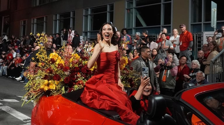Olympic gold medalist and Grand Marhsal Eileen Gu waves during...
