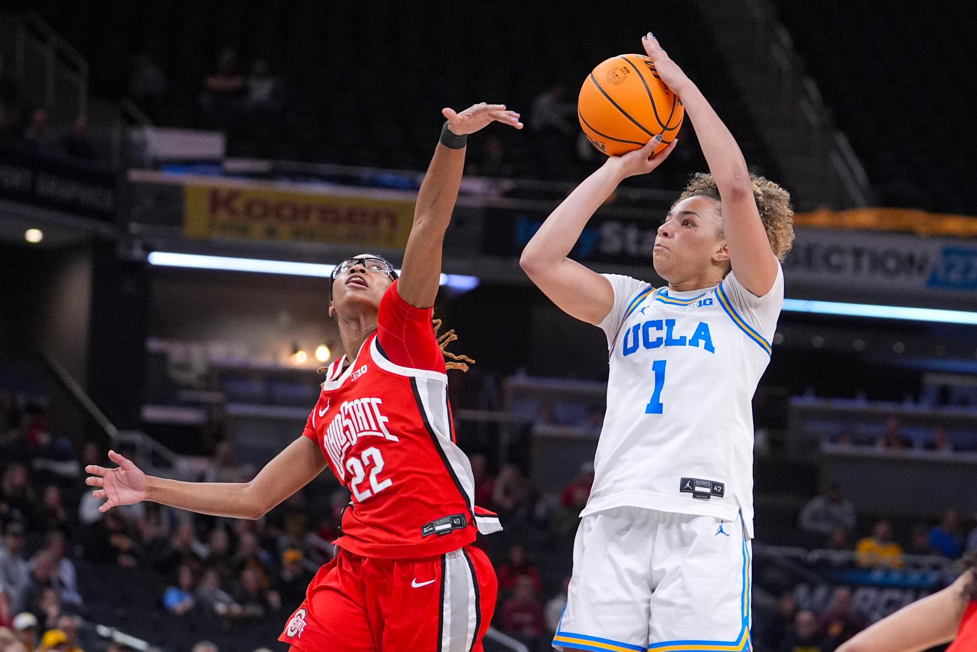 UCLA guard Kiki Rice shoots over Ohio State guard Jaloni Cambridge during the semifinals of the Big Ten tournament.