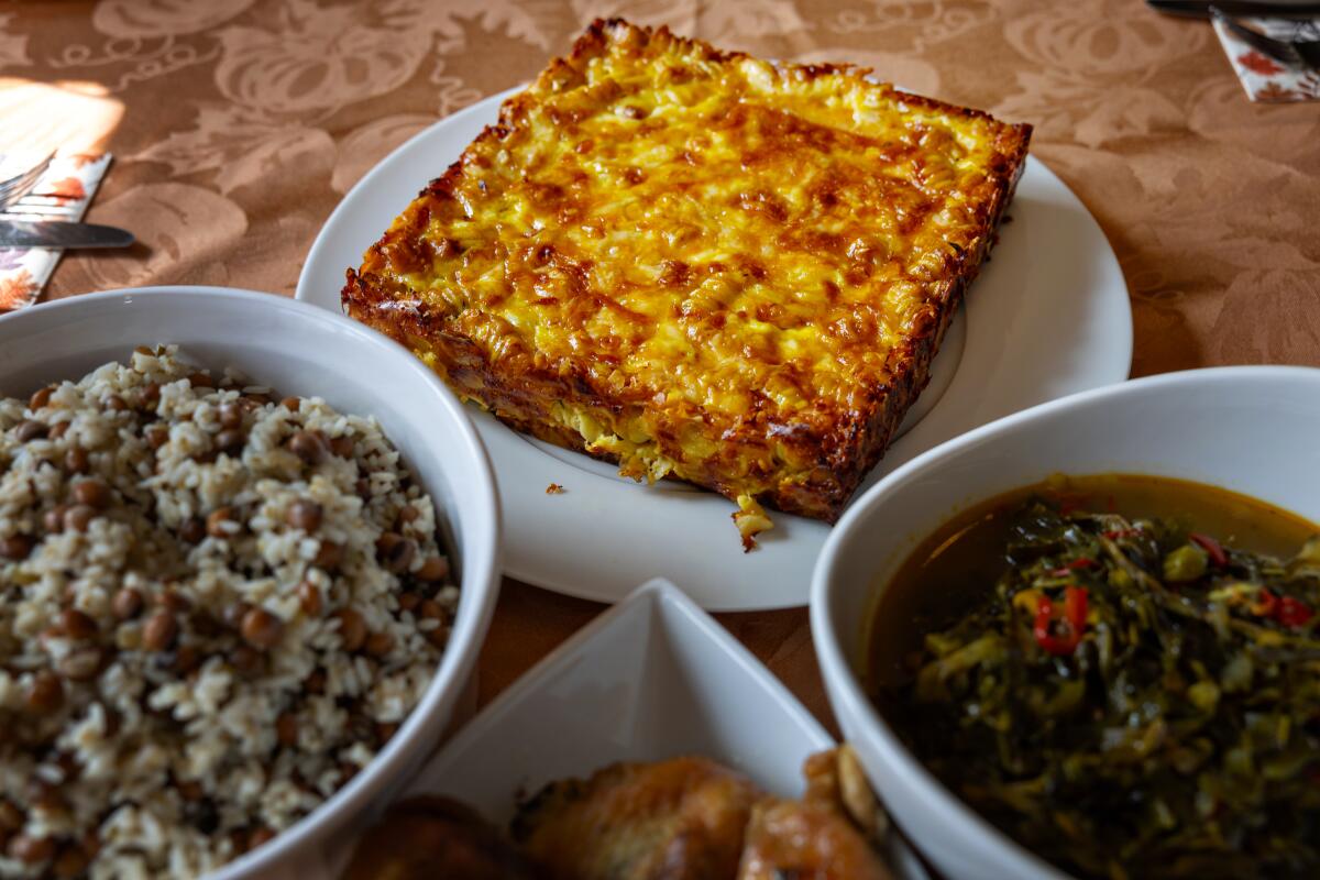 Rashida Holmes owner of Bridgetown Roti makes macaroni & cheese pie at her parents home