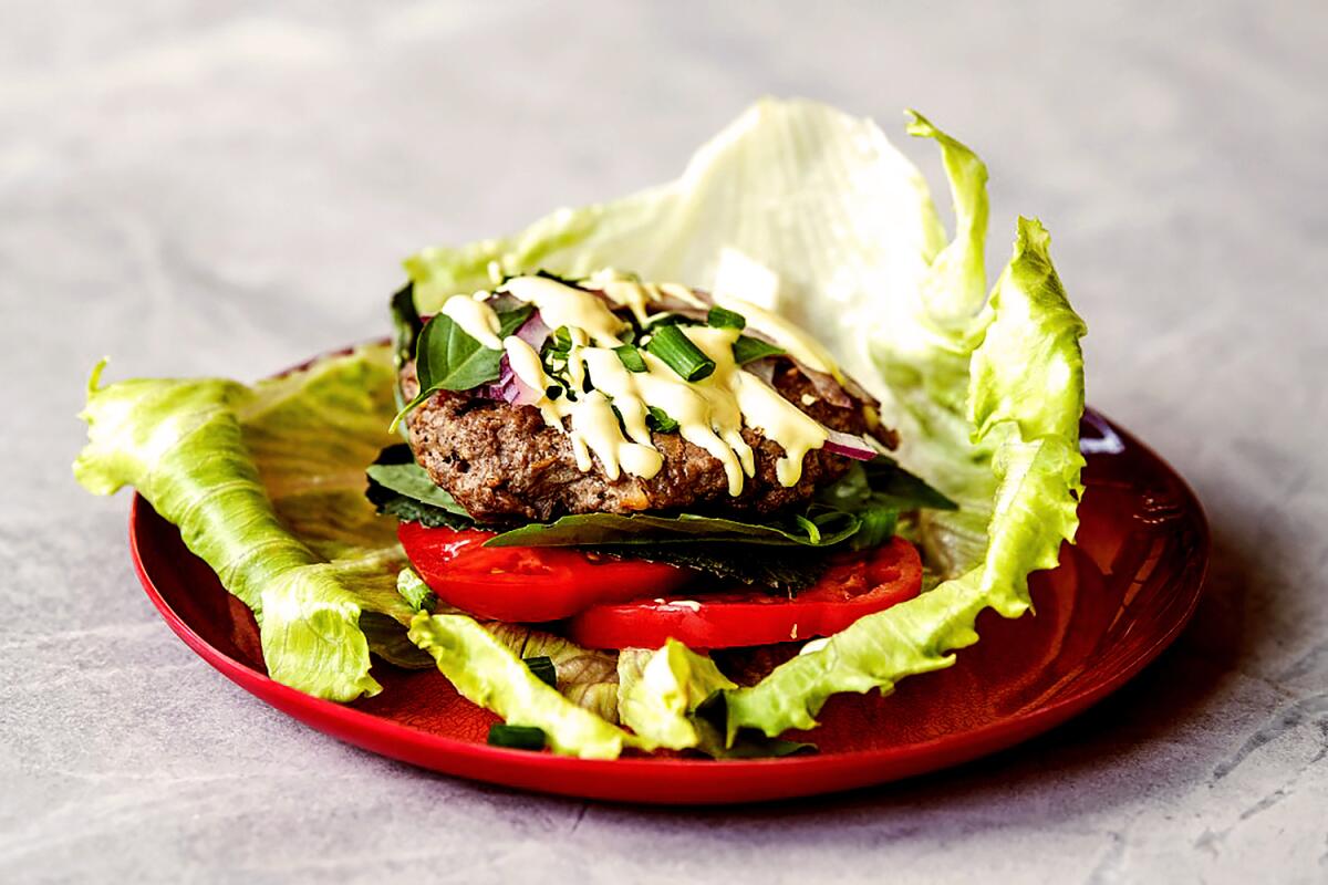 Jenn Harris' attempt at the Jazz Burger, the off-menu burger at Jitlada. Prop styling by Nidia Cueva.