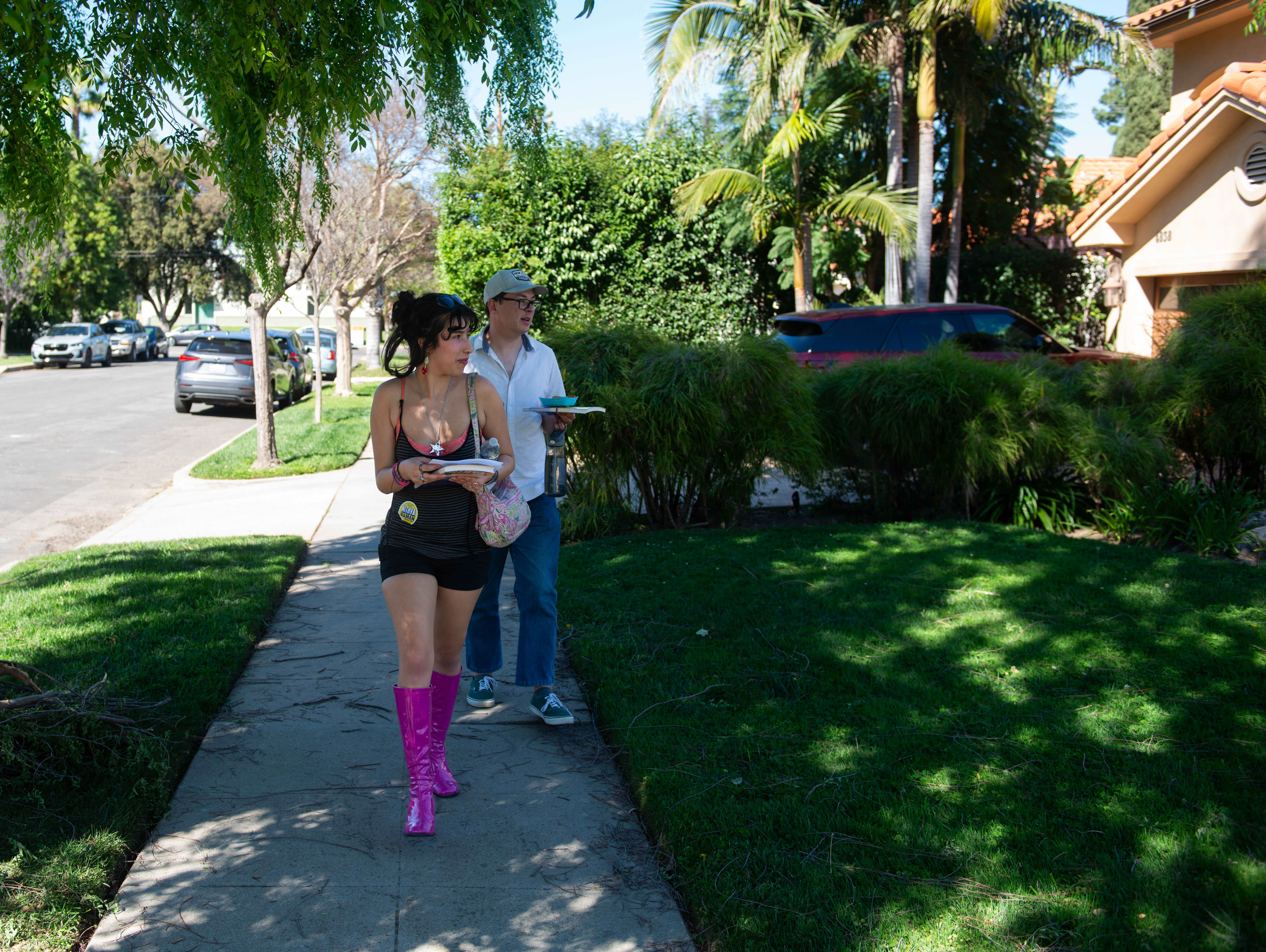 Gehena Rivera and Troy Davidson canvas the neighborhood across from...