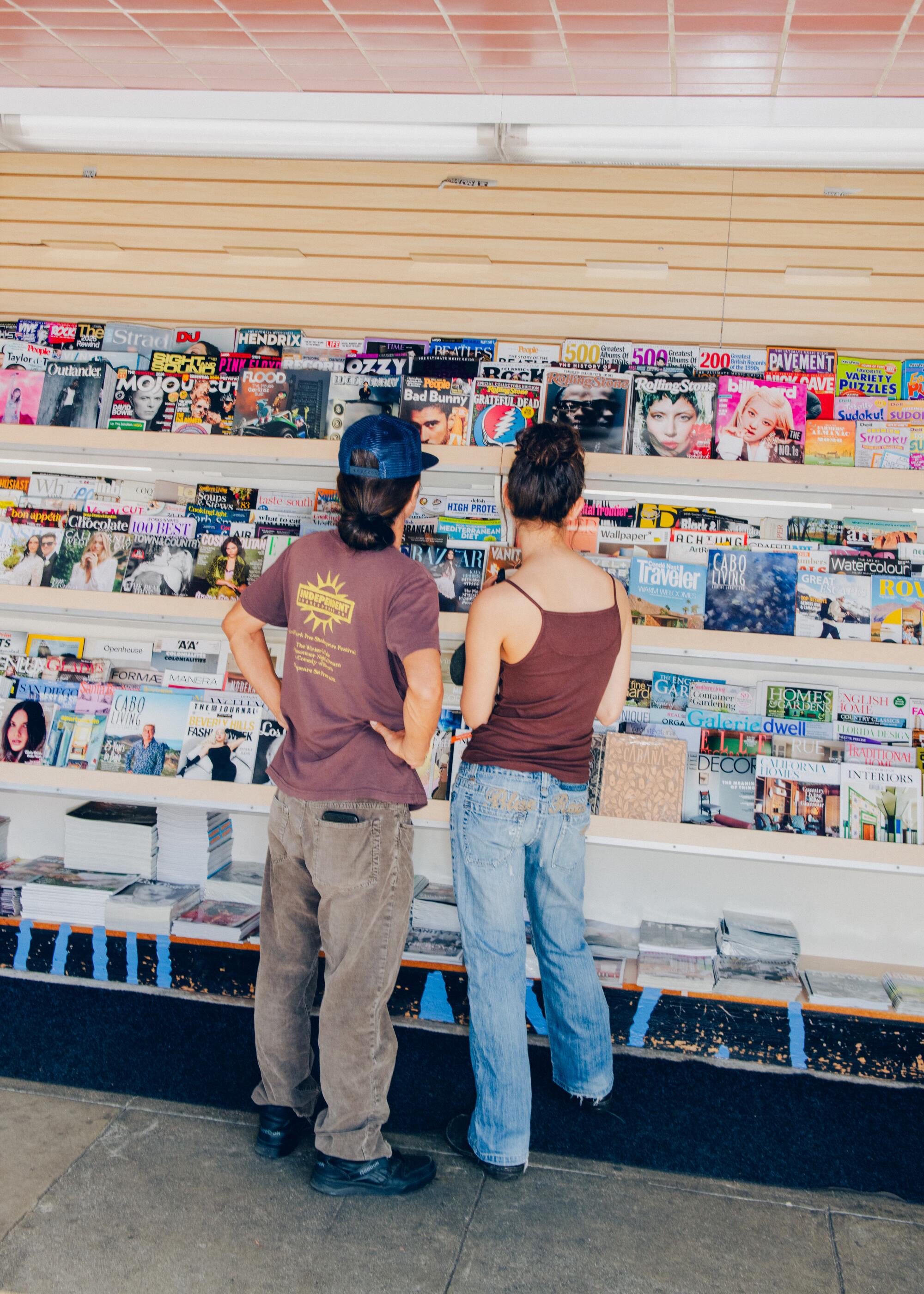 Customers Sonam Tsering (L) and Trinley Tsering (R) browsing magazines at Beverly Hills Newsstand. 