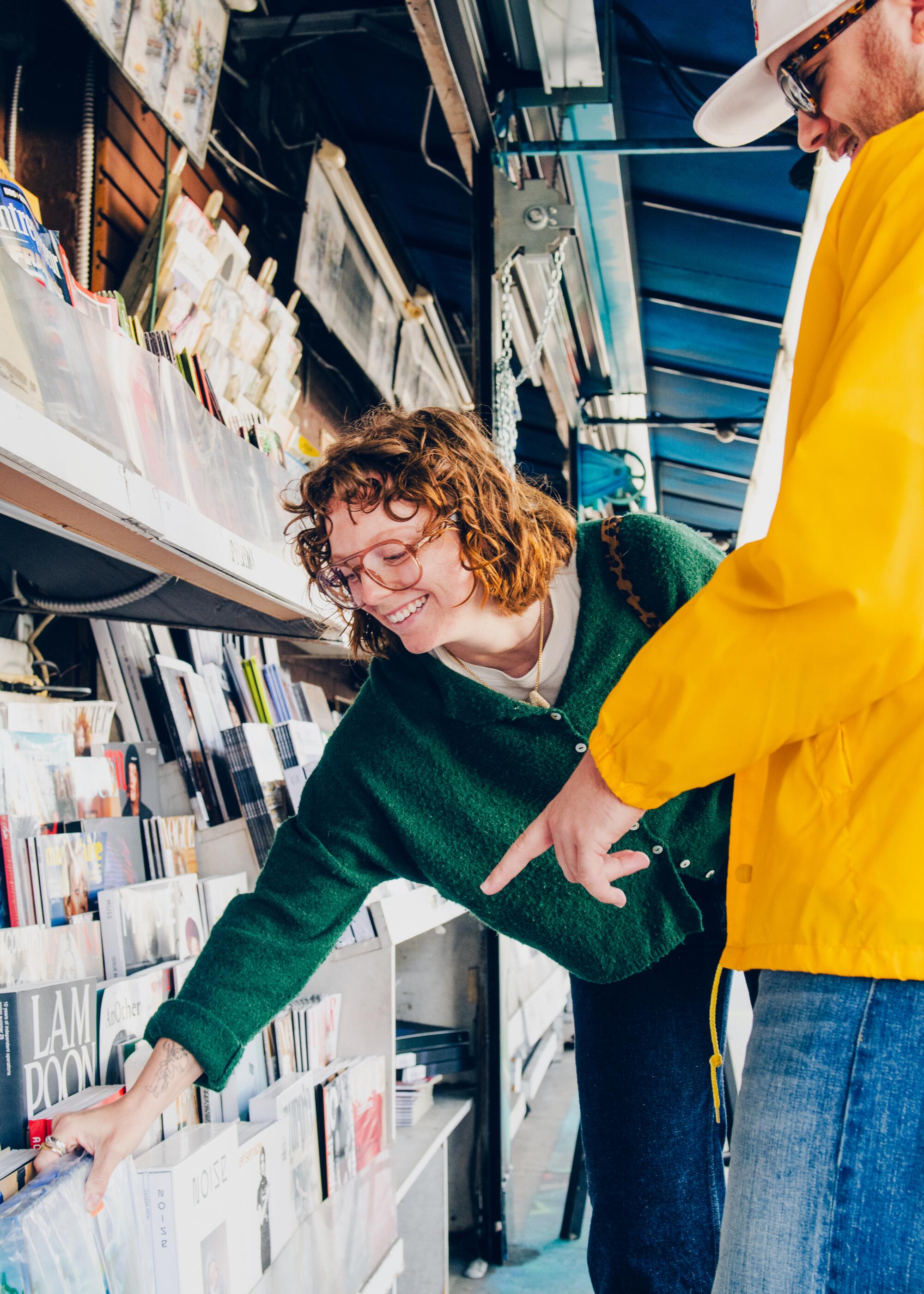 The Kosher News. Keegan, left, and Montana look at magazines.