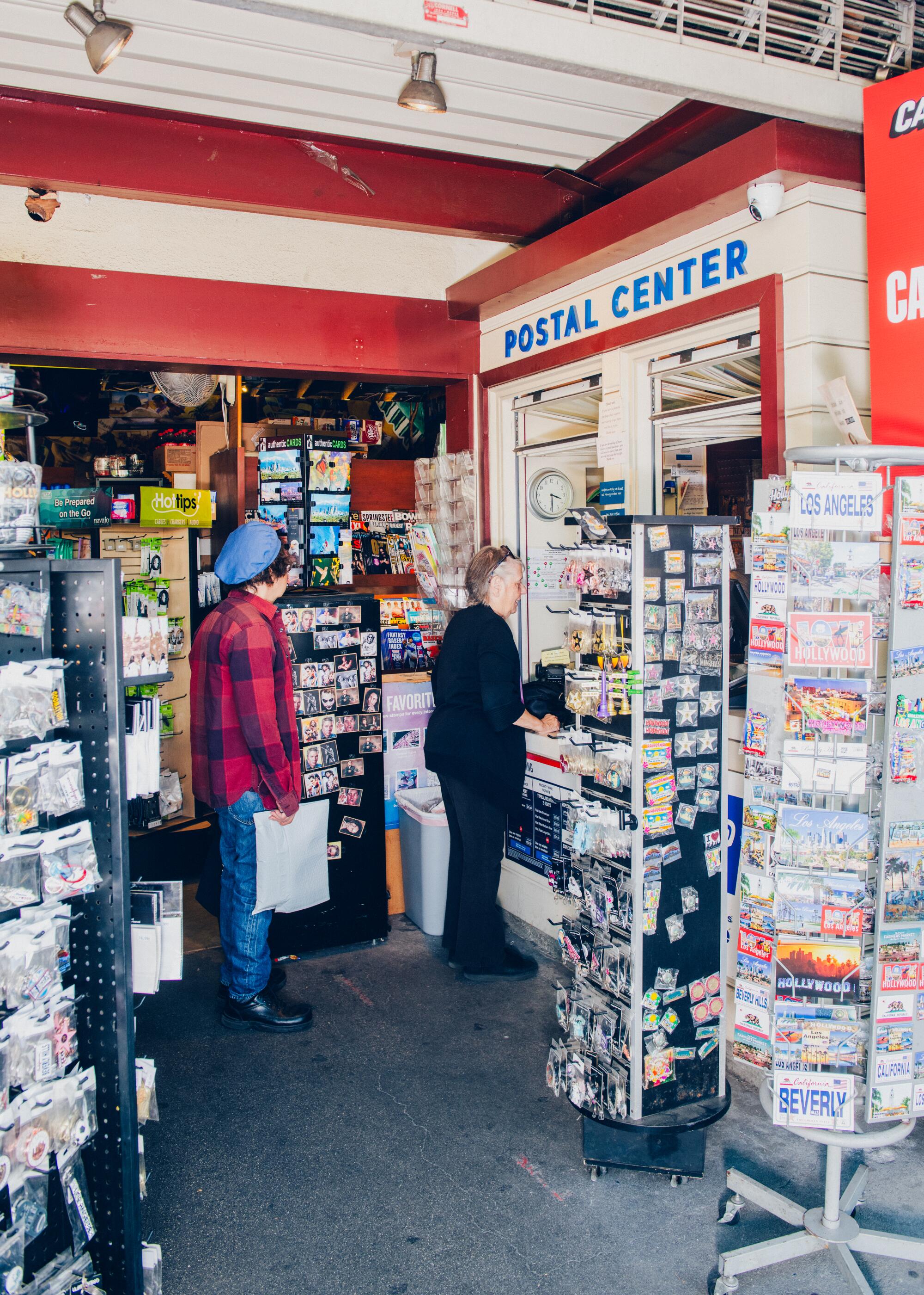 Customers use the Postal Center inside Sheltams Newsstand.