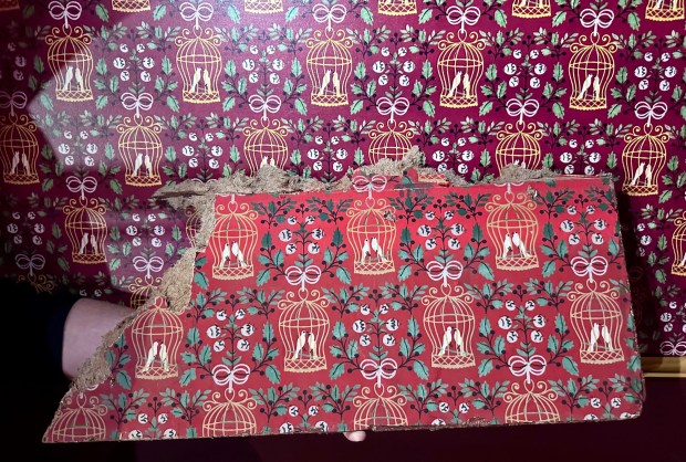 The new wallpaper (top) was designed to match the original (bottom) in the Bird Cage Theatre at Knott's Berry Farm. (Photo by Brady MacDonald, Orange County Register/SCNG)