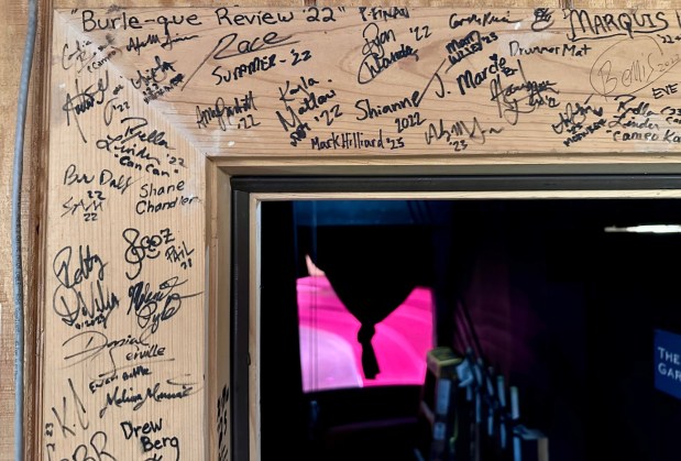 Autographs by past Bird Cage Theatre cast and crew dot a backstage doorframe at Knott's Berry Farm. (Photo by Brady MacDonald, Orange County Register/SCNG)