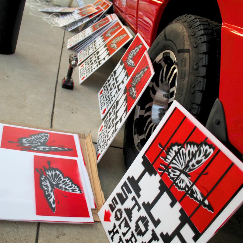 Ontario , CA - December 13: Leaning against Muñoz's truck, the fresh batch of "ICE Stole Someone Here" signs were ready to be distributed the following morning. Galvan said they chose to make the signs by hand to "make it feel personal."