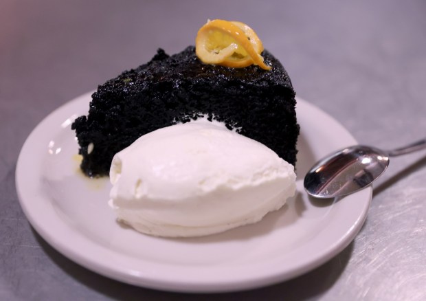 Chocolate cake with mandarini and vanilla cream is served at Bar Panisse on Shattuck Avenue in Berkeley, Calif., on Monday, Feb. 23, 2026. The restaurant is the latest project from Alice Waters, the California chef who helped start the slow food farm-to-table movement. (Jane Tyska/Bay Area News Group)