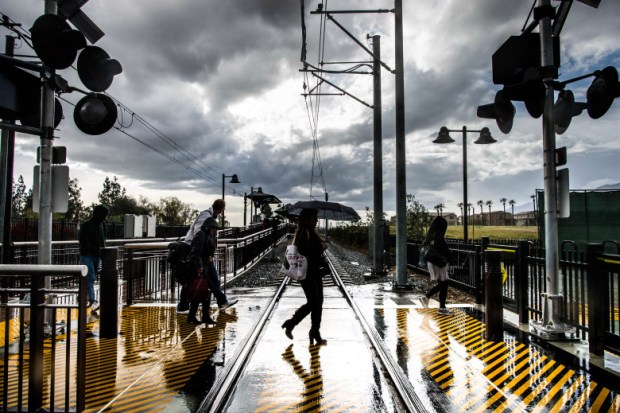 Evening commuters approach to the parking structure after arriving at the APU/Citrus College Gold Line station in Azusa on Monday, March 7, 2016. (Photo by Watchara Phomicinda/ San Gabriel Valley Tribune)