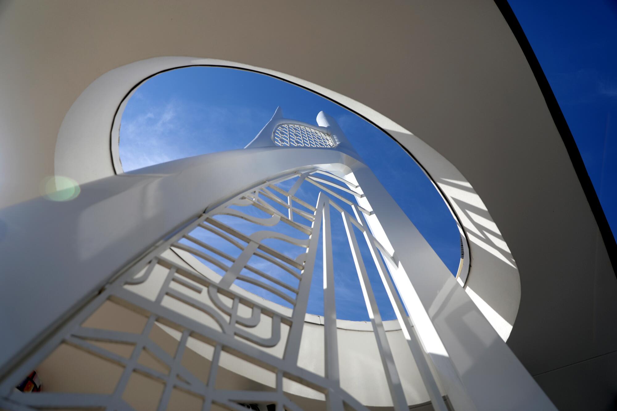 Legacy Tower patterns and lattice spirals toward the sky.