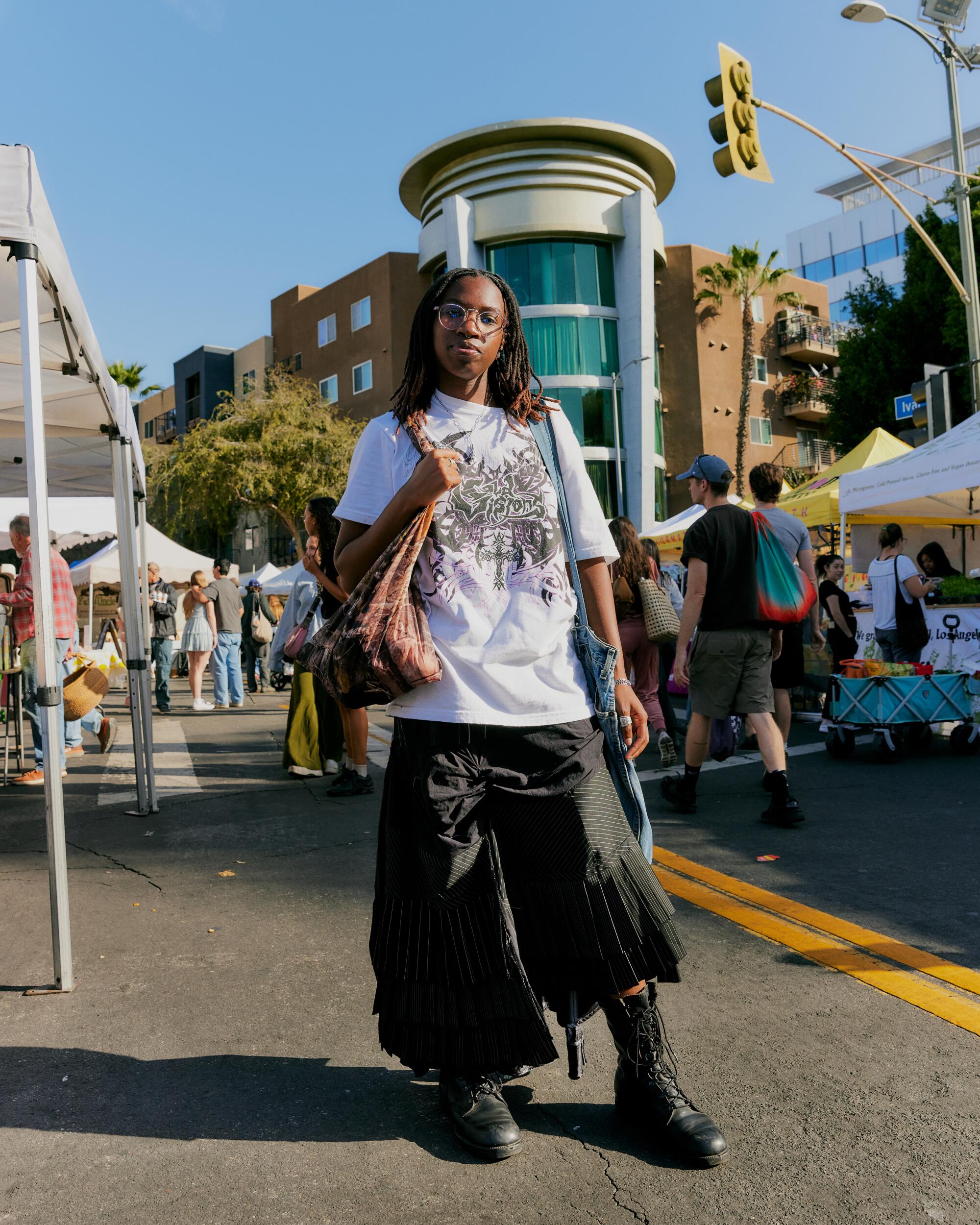 Paige McGowan wears a Hiroko Hata skirt, vintage shirt and vintage tote.
