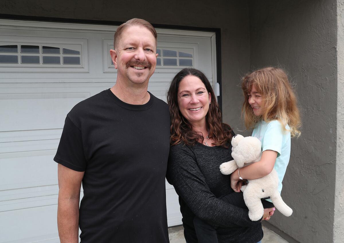 Shawn Kortes with wife Jenny and daughter Charli, at their Huntington Beach home.