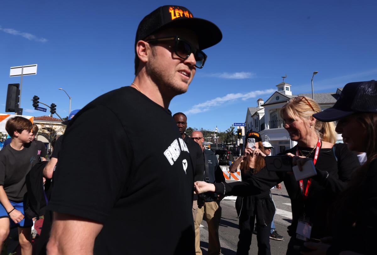 Pacific Palisades resident Spencer Pratt, who lost his home in the Palisades fire, stands with supporters.
