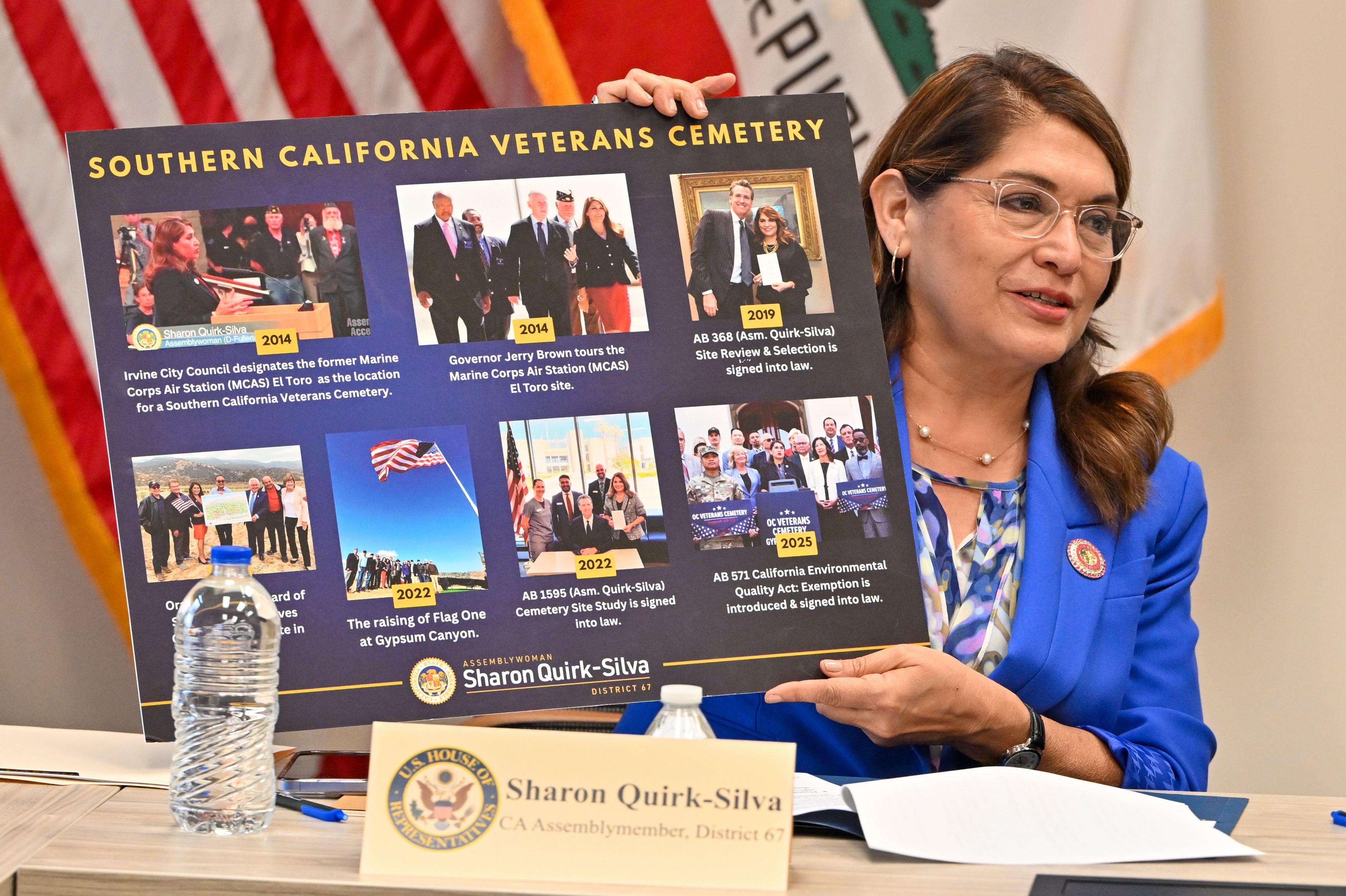 Assemblymember Sharon Quirk-Silva, left, shows a board with highlights of...