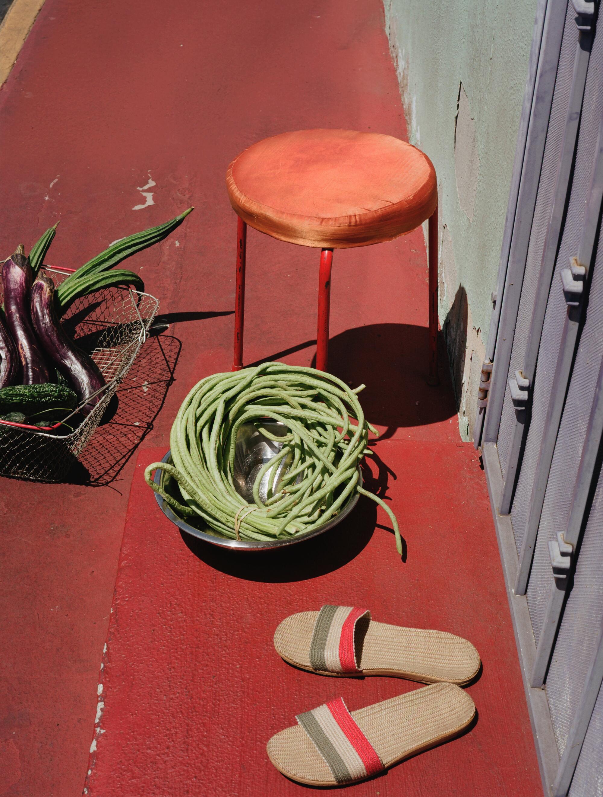 Photographer’s own striped sandals. Stylist’s own vintage silk top stool, metal basket and bowl.