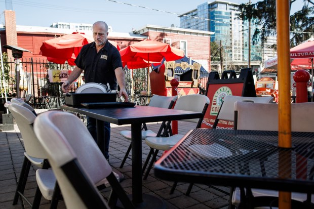 Lunchtime remains quiet at Poor House Bistro as owner Jay Meduri works on the front patio of his restaurant, Jan. 15, 2026, in San Jose's Little Italy neighborhood. Meduri says business has slowed since Google bought his former property and moved the restaurant building in 2022 to make way for the company's planned Downtown West development, which has yet to materialize. (Dai Sugano/Bay Area News Group)