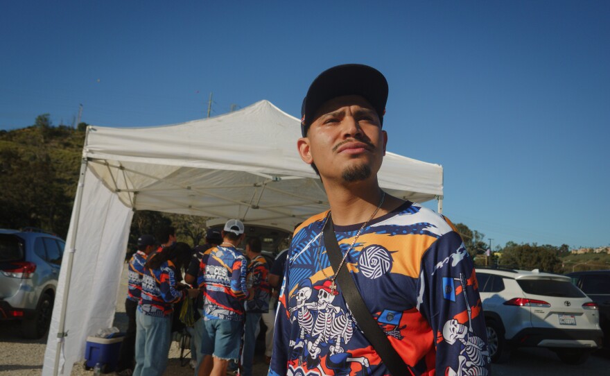 Bryan Olivo-Bautista, a member of the San Diego FC supporters group Pocos Pero Locos, stands for a portrait outside Snapdragon Stadium in San Diego, California, ahead of a game on March 1, 2026. Olivo-Bautista was detained by federal immigration officials in early February despite being a DACA recipient.