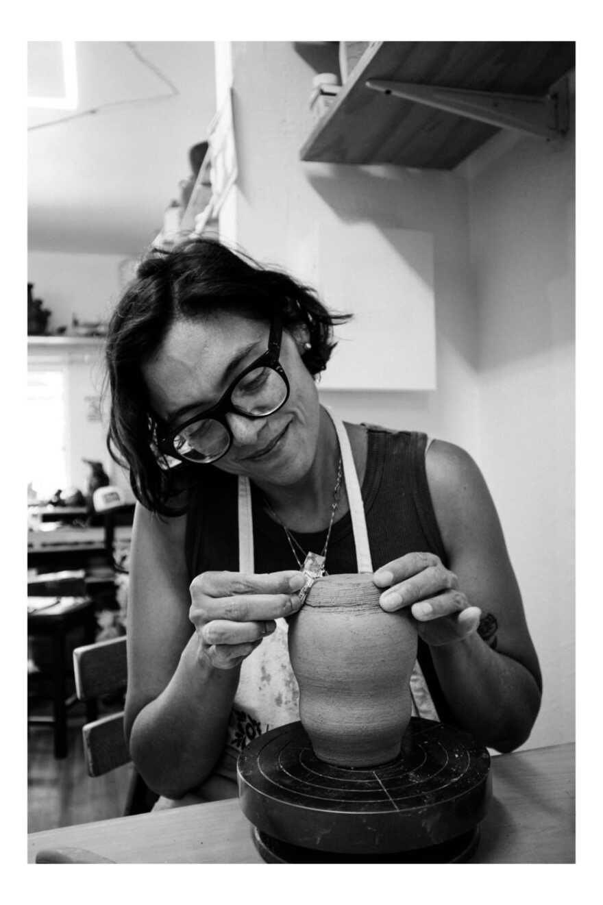 Artist Annie Alarcón is shown working with pottery in an undated photo.