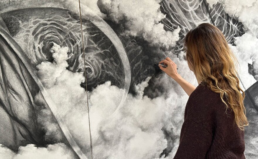 Tatiana Ortiz-Rubio is shown in an undated photo working with charcoal on a new piece to be revealed at Camarada's "In Search of Time" concert.