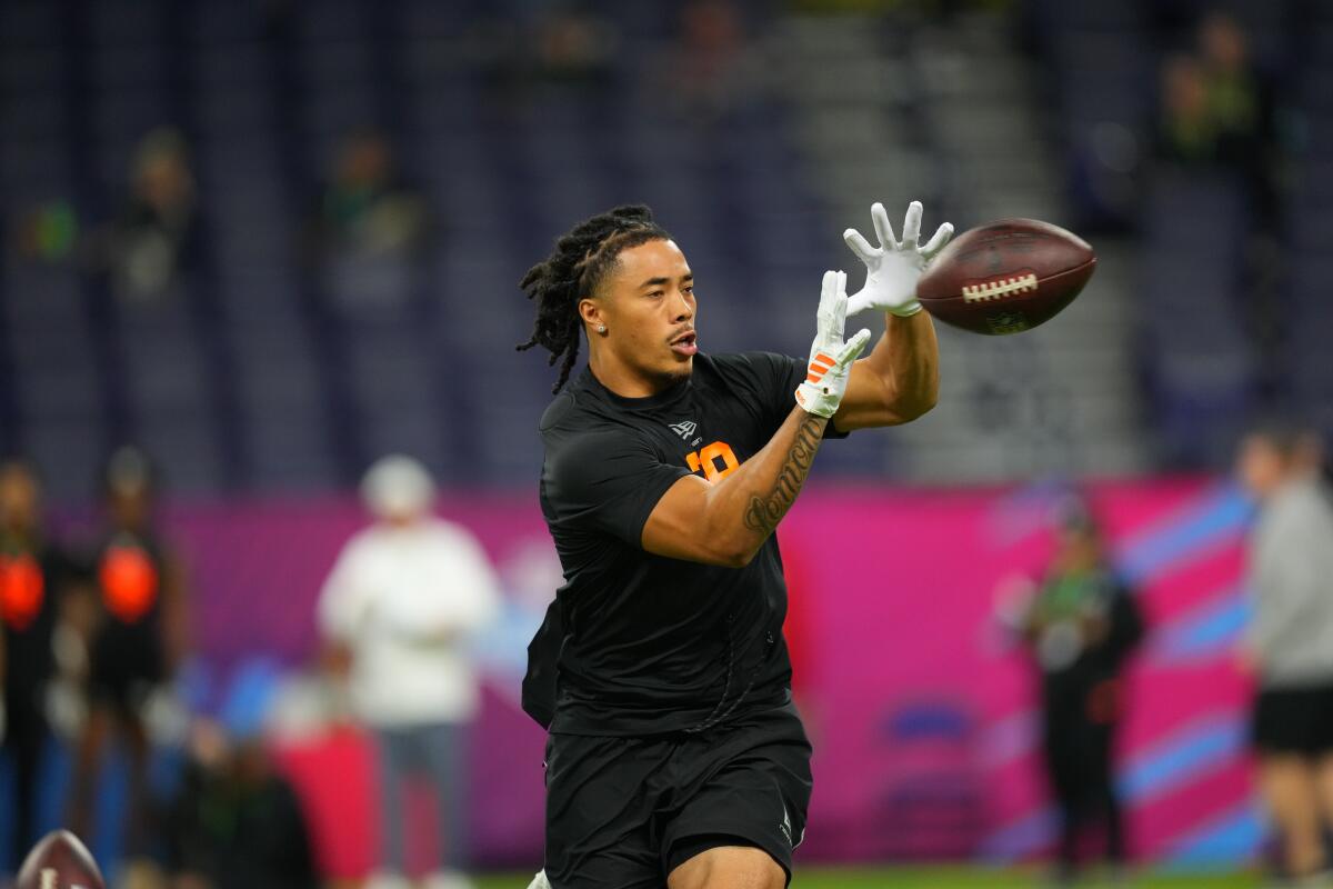 USC receiver Makai Lemon catches pass during a drill at the NFL combine in Indianapolis last month.