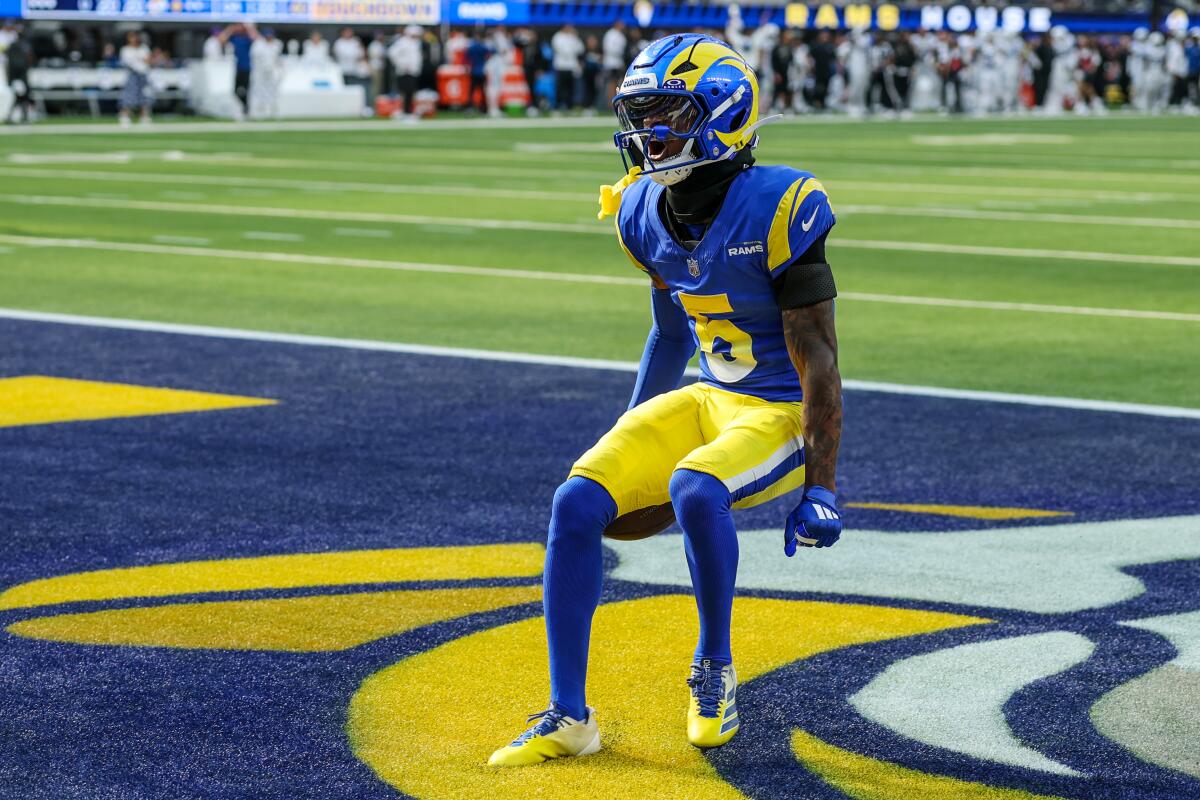 Rams wide receiver Tutu Atwell celebrates in the end zone after catching an 88-yard touchdown pass.