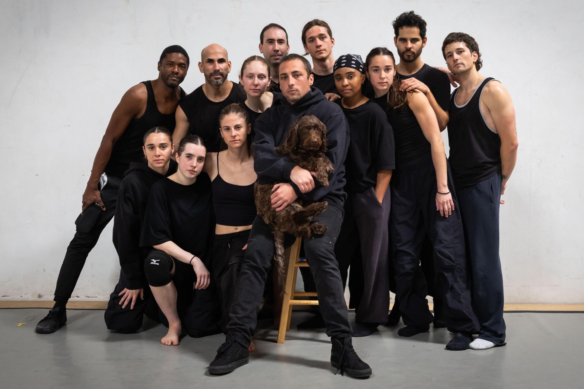 A dance troupe with a dog.