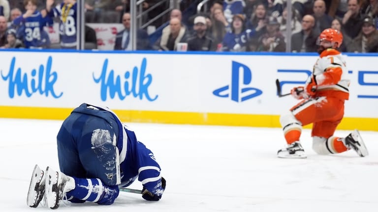 Toronto Maple Leafs Auston Matthews, left, is injured by Anaheim...