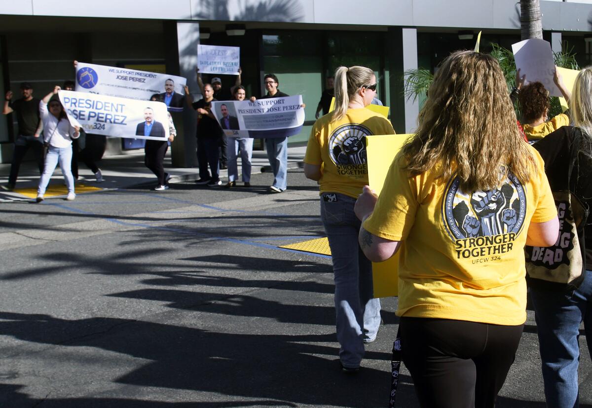 Workers protesting UFCW 329's new president encountered a counter-protest by his supporters.