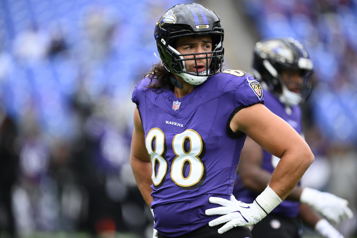 Baltimore Ravens tight end Charlie Kolar warms up before a game against the Rams on Oct. 12.