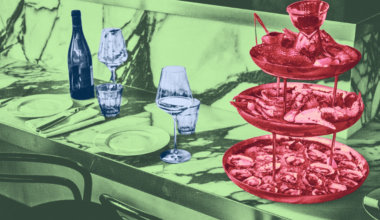 A smiling young woman with blonde hair and dark roots holds a microphone, wearing a black shirt against a light background with partial text.