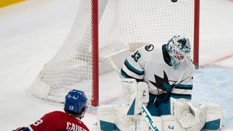 Montreal Canadiens' Cole Caufield (13) scores on San Jose Sharks...