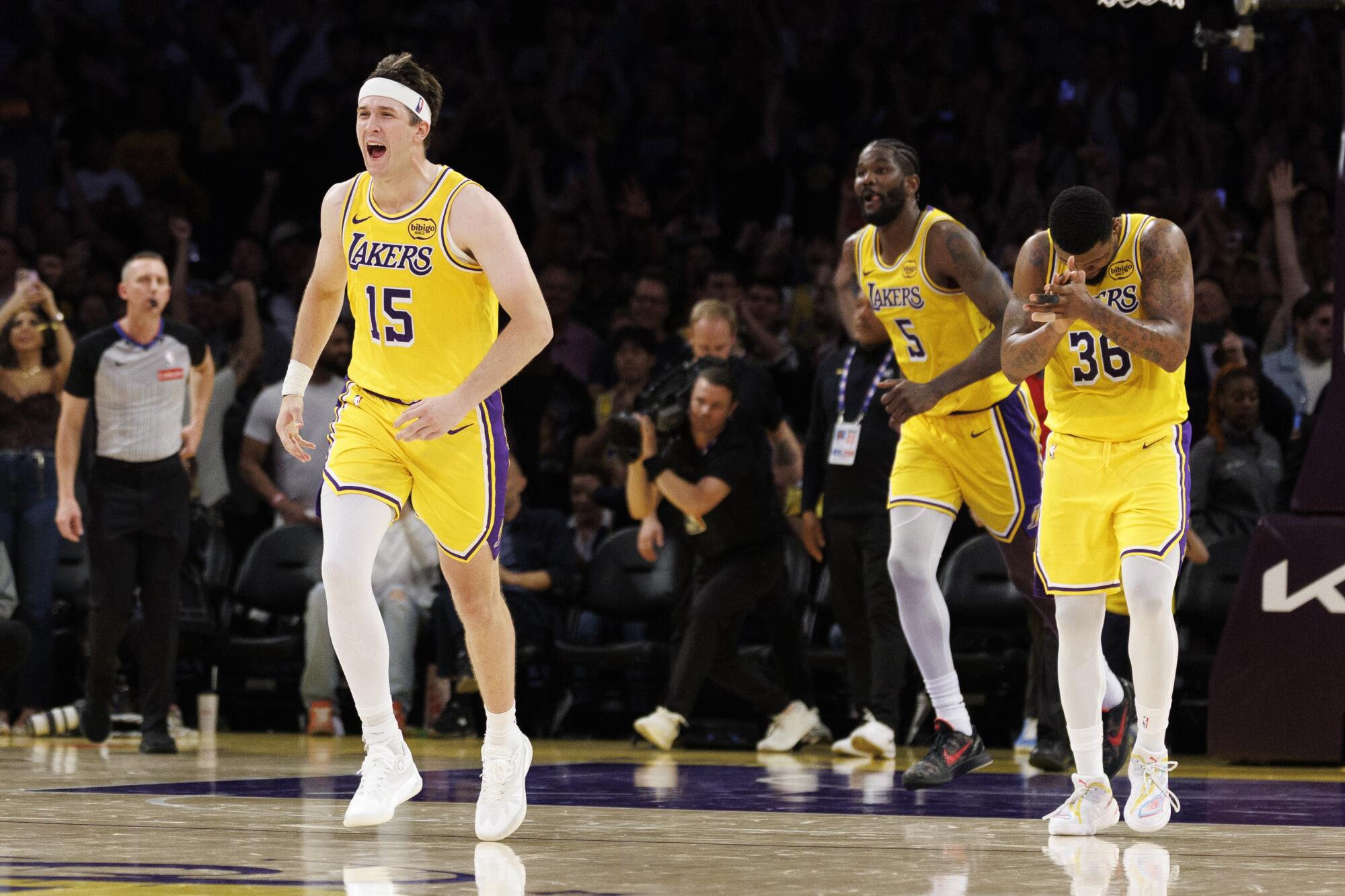 Lakers guard Austin Reaves celebrates during the Lakers' win over the Denver Nuggets on Saturday night.