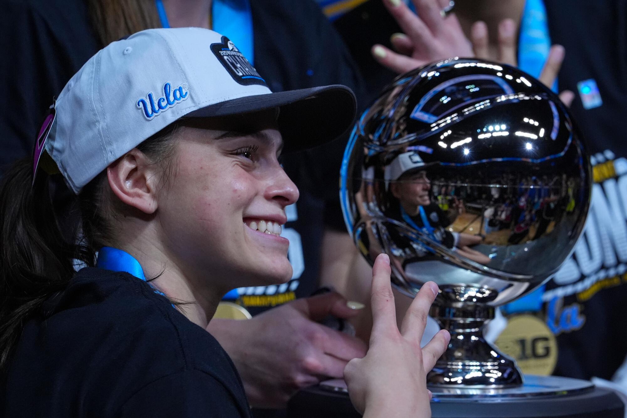 UCLA senior Gabriela Jaquez celebrates with the Big Ten tournament trophy after the Bruins beat Iowa in the finals.