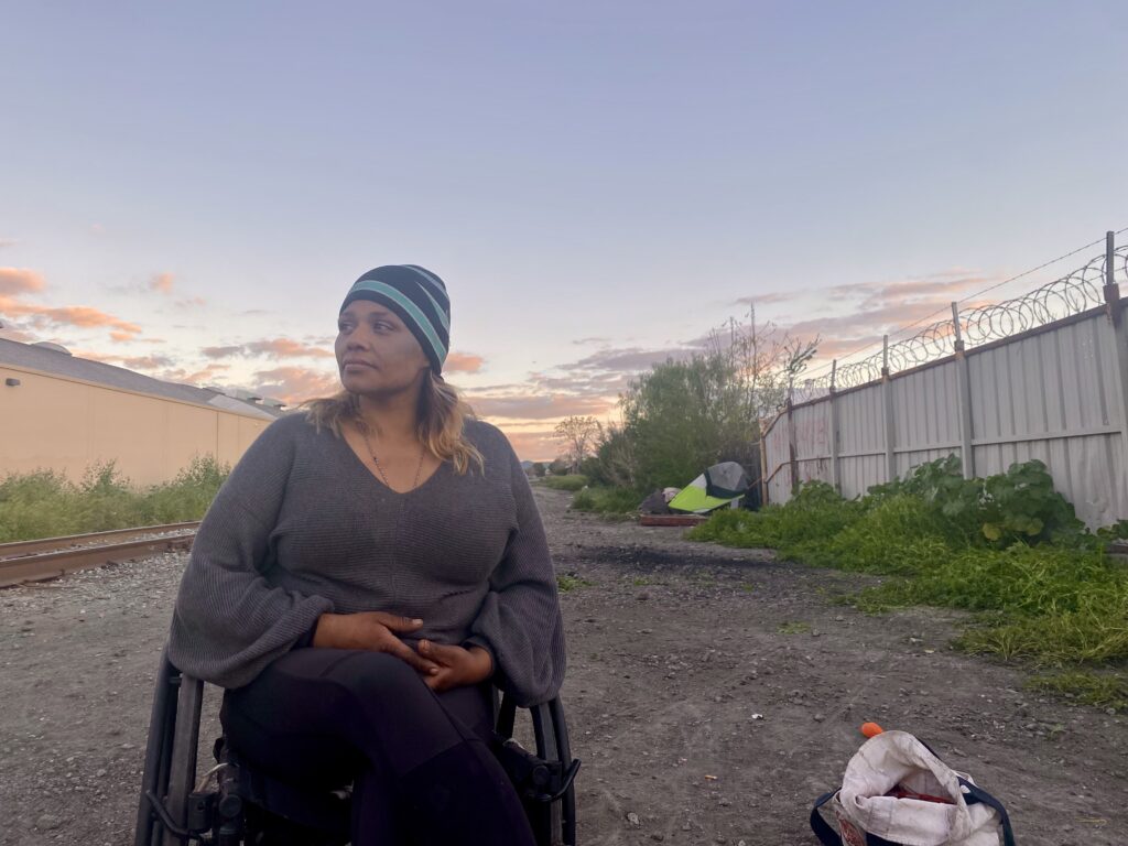 a homeless woman in a wheelchair