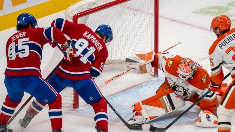 Anaheim Ducks goaltender Lukas Dostal, second from right, stops a...