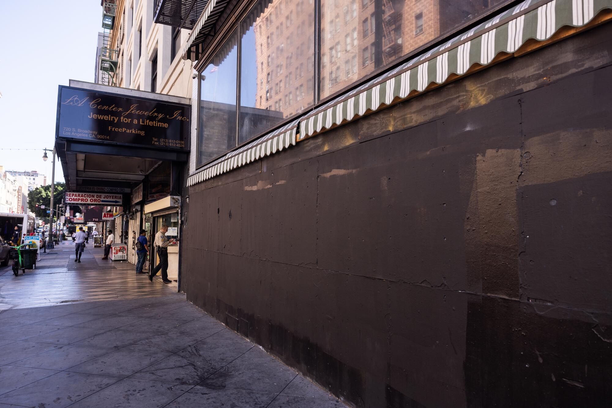 A boarded-up storefront on Broadway. 