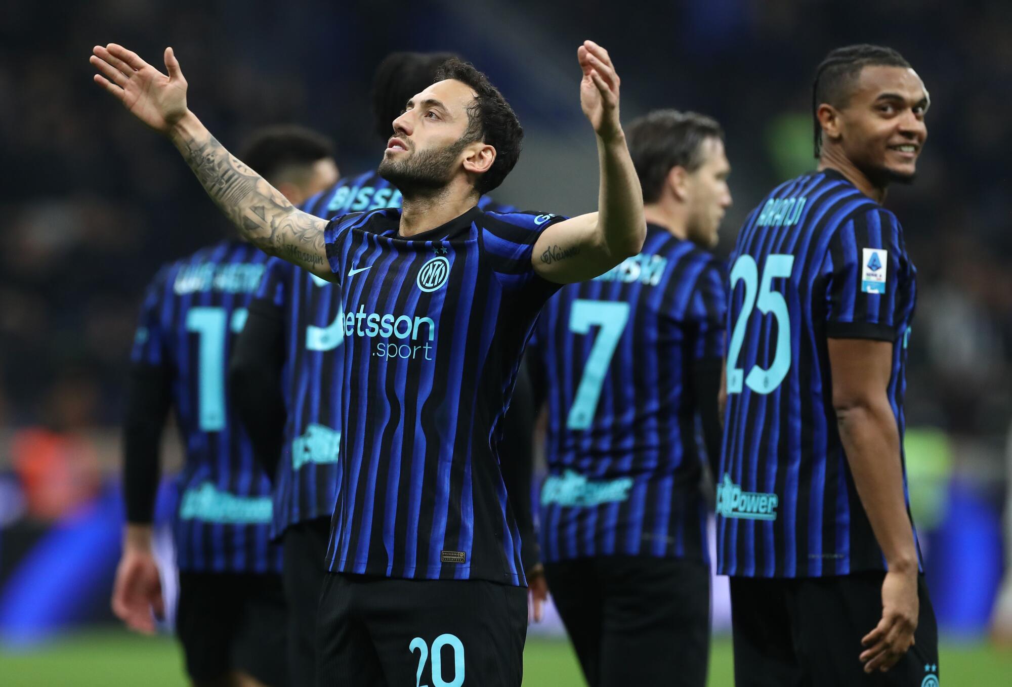 Inter Milan's Hakan Calhanoglu celebrates after scoring on a penalty shot against Genoa on Feb. 28.
