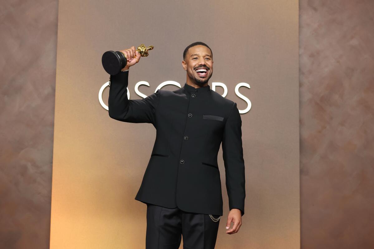 Michael B. Jordan holds his Oscar for Actor in a Leading Role for "Sinners" during the 98th Annual Academy Awards 