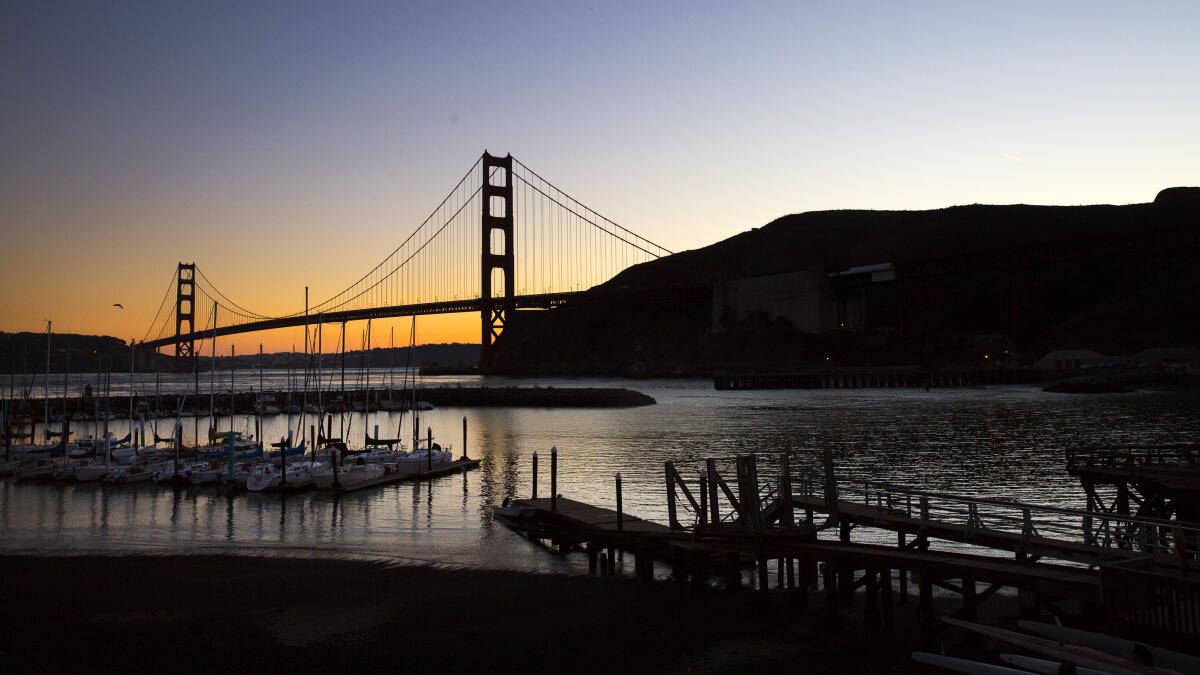 A bridge over water at dusk.