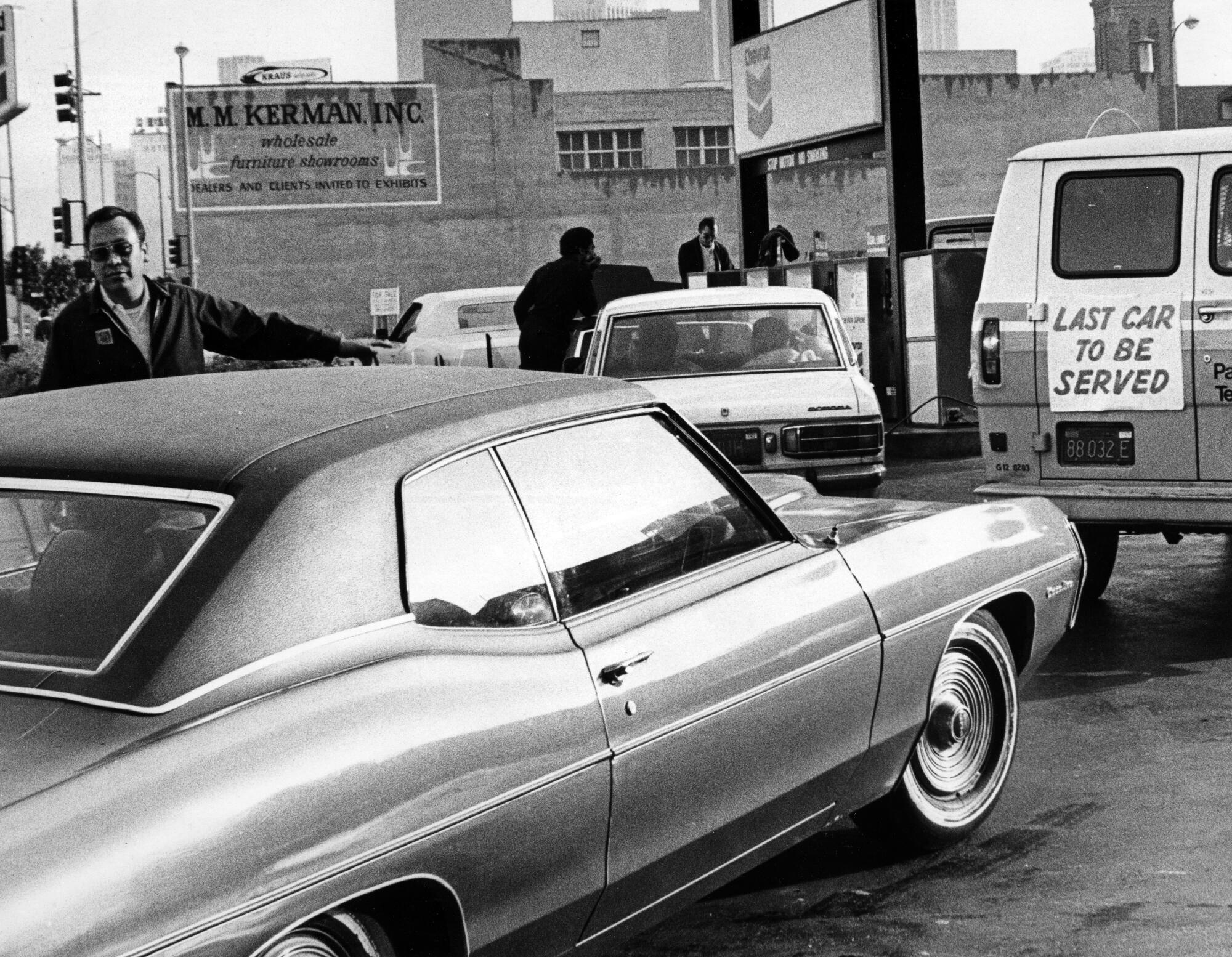 The owner of Chevron Standard gas station attached a sign to the rear of the last vehicle he could serve one day in 1974.