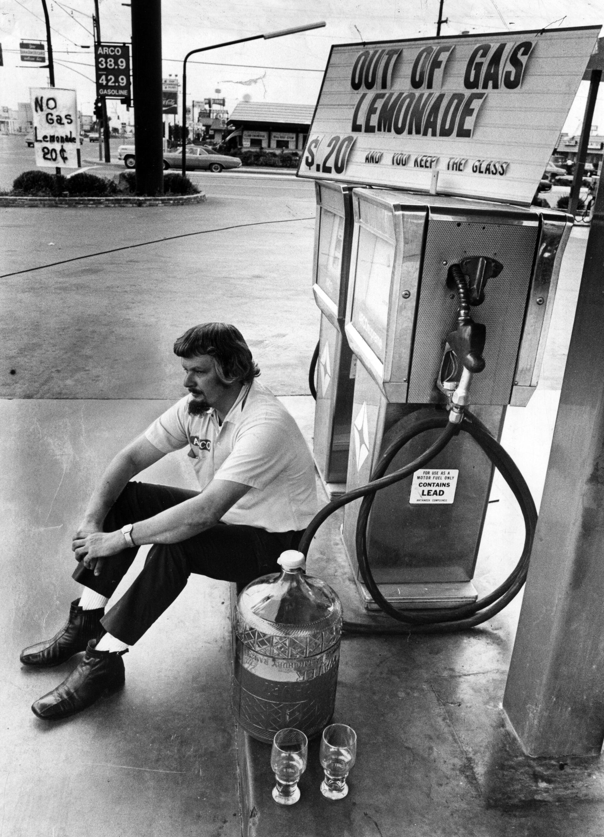 Arco dealer Bob Smith sells lemonade at his gas station in Costa Mesa in 1973