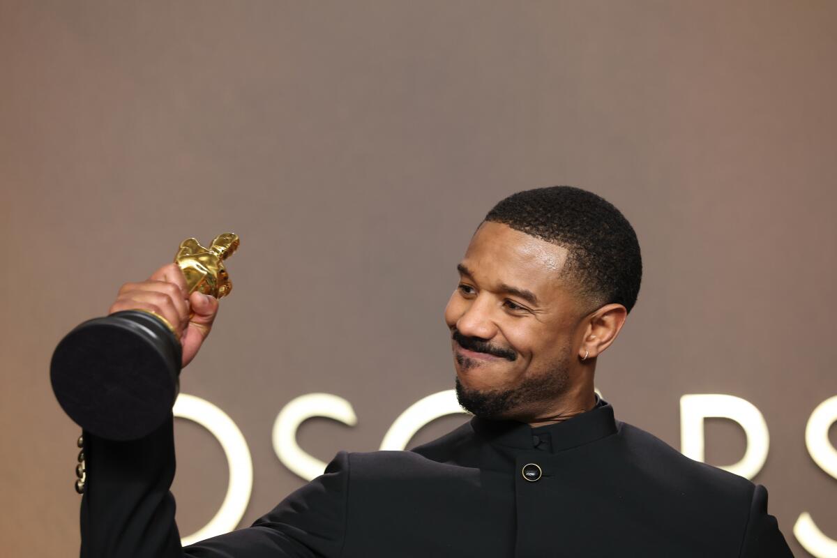 Michael B. Jordan holds his Oscar for Actor in a Leading Role for "Sinners."