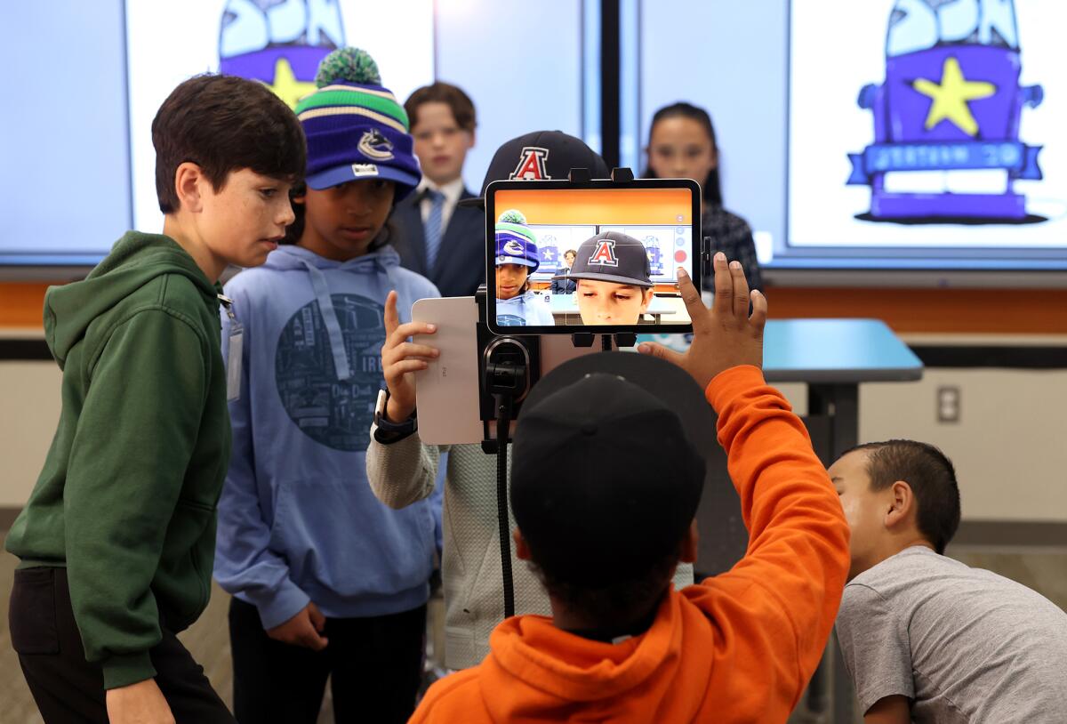 Fourth and fifth graders work behind the scenes producing the student-run broadcasting program, Sea Star News.