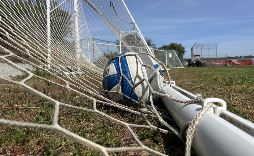 A soccer ball sits under soccer goal netting at San Diego Jewish Academy, March 16, 2026.