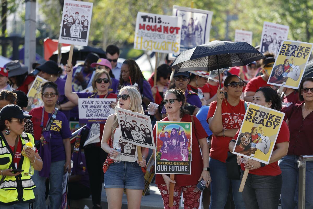 Teachers, union members, attend a rally