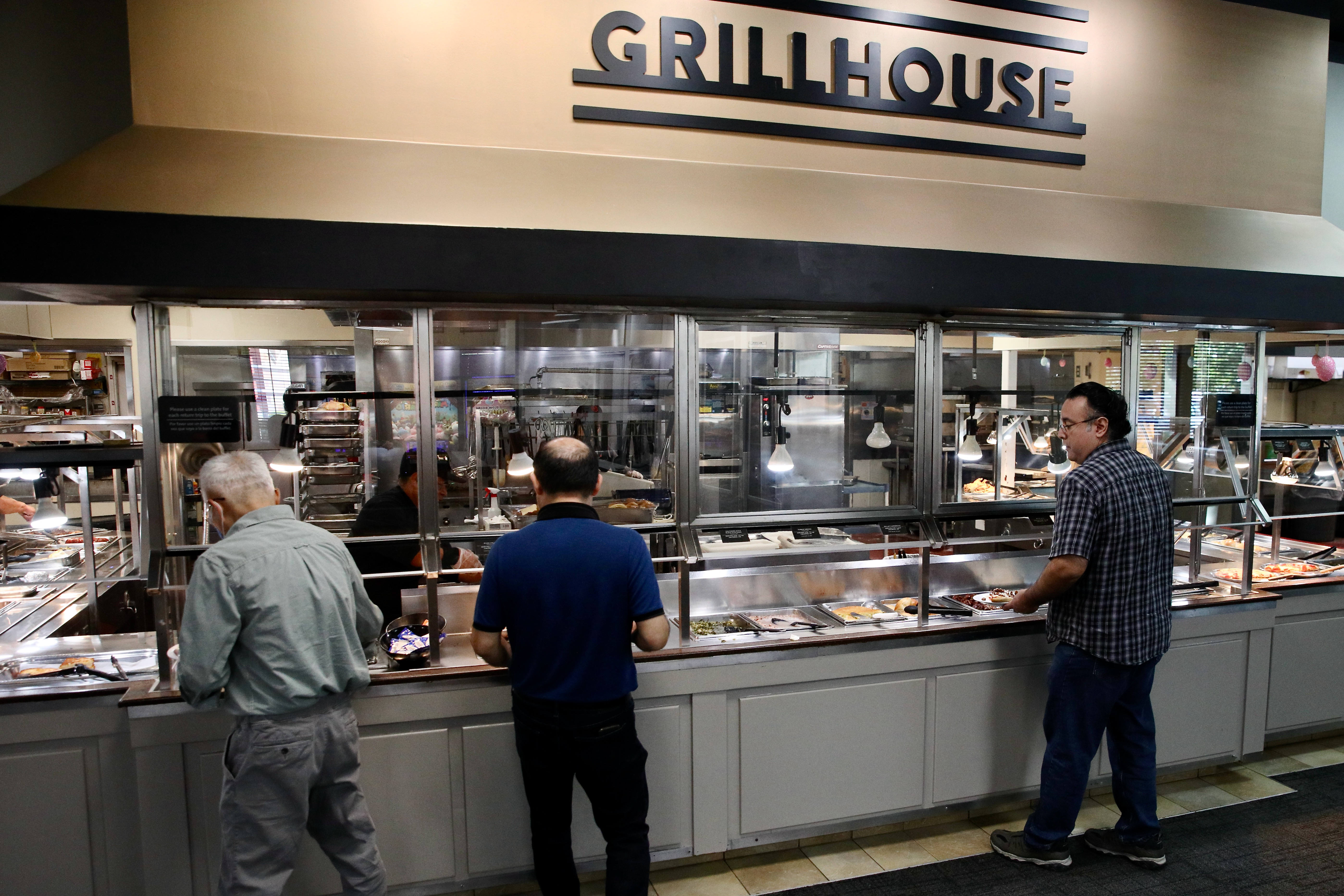 Patrons visit the buffet during lunch hour at Golden Corralâs...